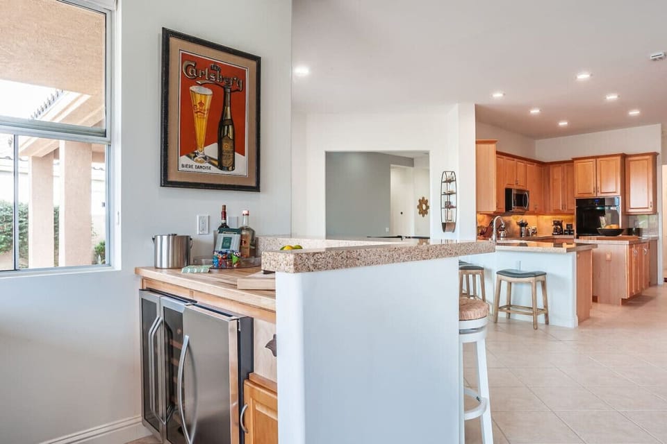 A kitchen and bar space designed for effortless entertaining—where style meets function in the heart of the home.