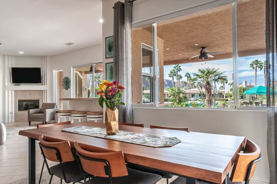 Where conversations flow as smoothly as the panoramic views—this dining space is a feast for the senses.