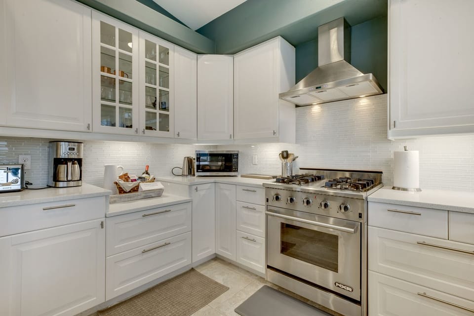 Gourmet kitchen includes herbs, spices, oil, tea, coffee, etc.