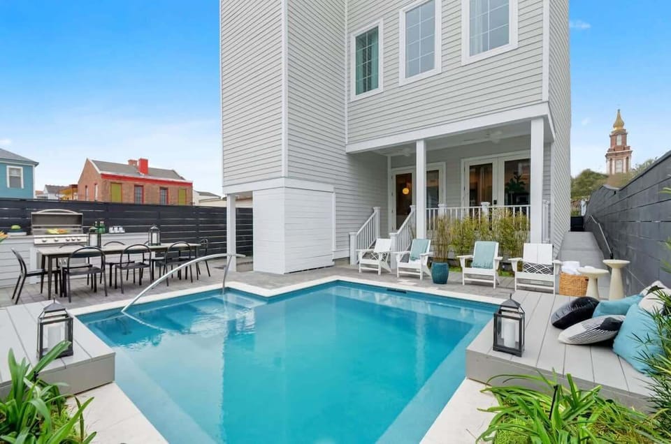 Shared Outdoor Area with Porch | Seasonal Heated Pool | Grill | Outdoor Dining Table | Outdoor Seating Area | Shared with Other Unit in the Building