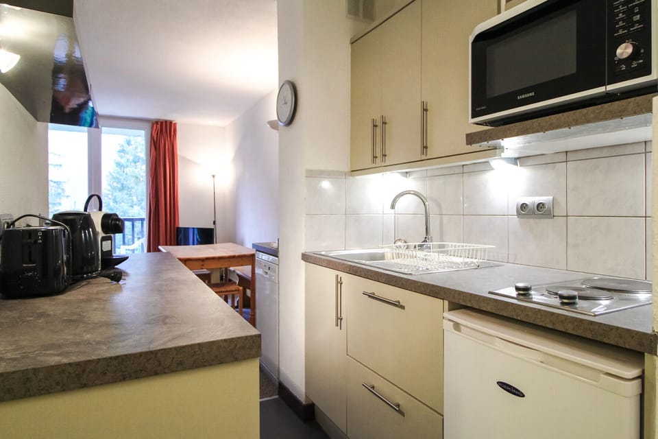 Galley kitchen leading to the living room & dining area
