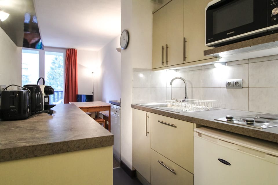 Galley kitchen leading to the lounge