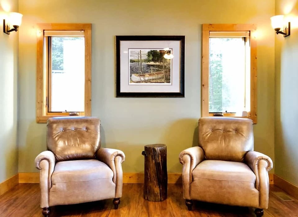 Primary Bedroom on the main floor with deck access and sitting area