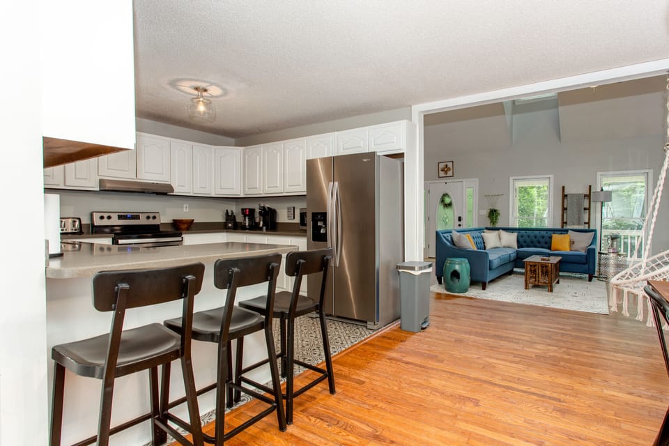 Island bar area off the kitchen. Kitchen is open to the dining area and table