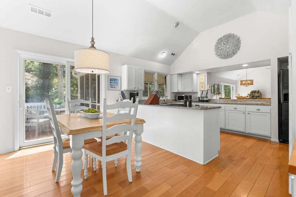 The dining table in the kitchen seats four.