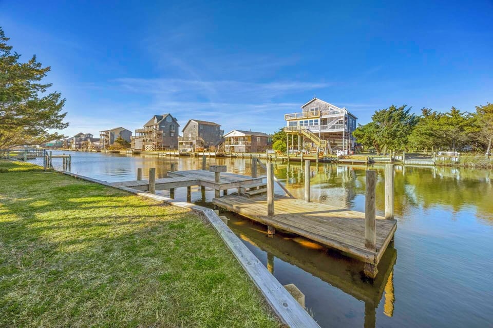 Waterfront community with private docks and charming coastal homes along peaceful waters.