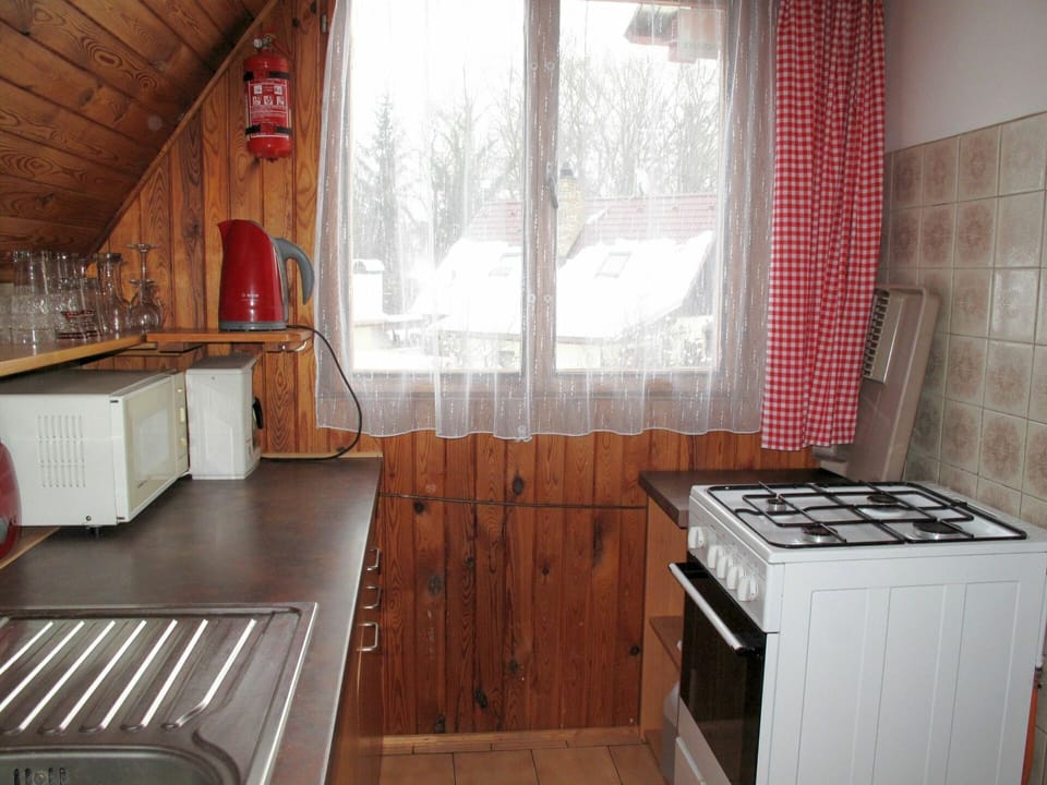 Cabinetry, Property, Furniture, Countertop, Kitchen, Kitchen Appliance, Window, Wood, Kitchen Stove, Interior Design