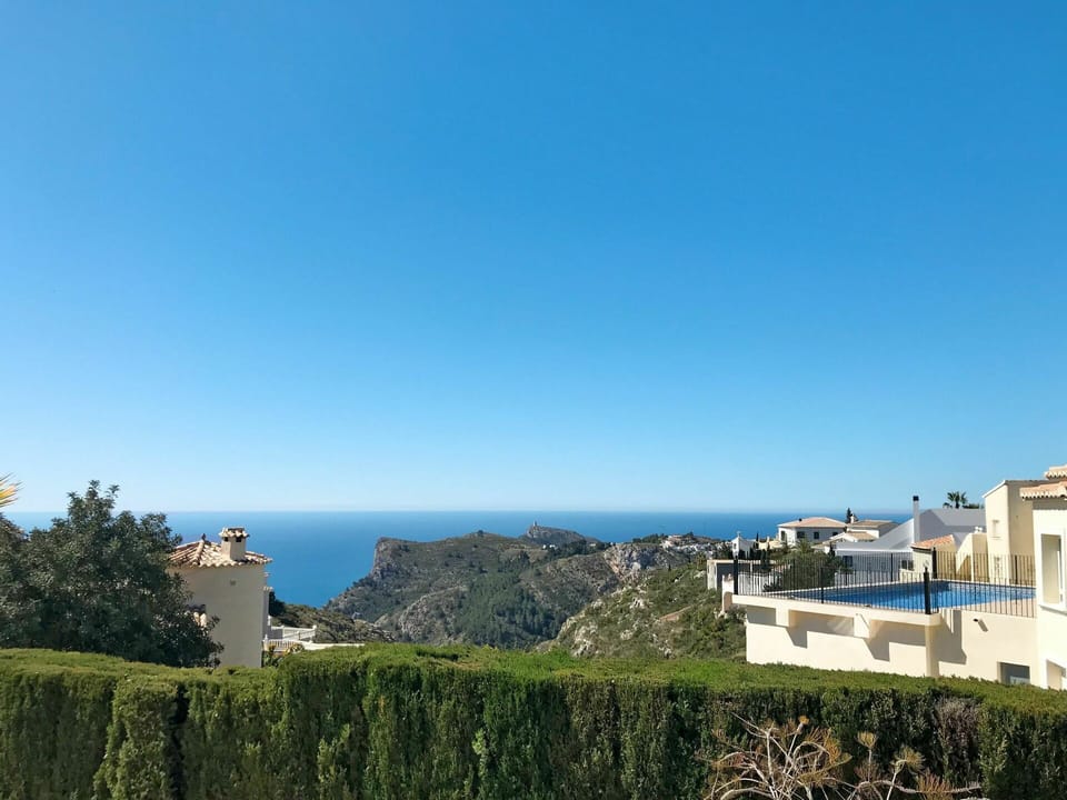 Sky, Building, Plant, Cloud, Window, Azure, Coastal And Oceanic Landforms, Terrain, Horizon, Landscape