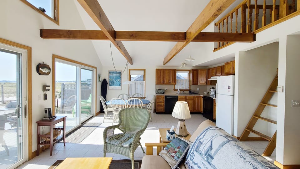 Vaulted ceiling with exposed beams and open loft