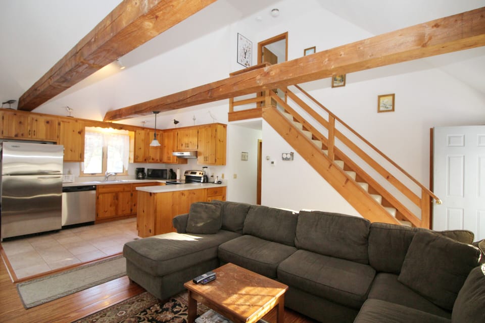 Family room with comfortable seating opens to kitchen
