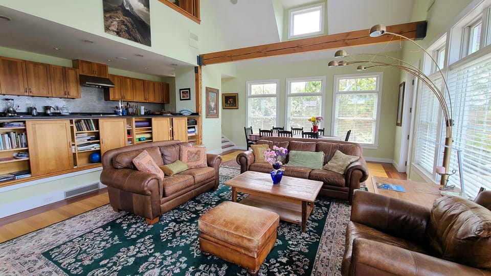 Living room with dining area and open kitchen beyond