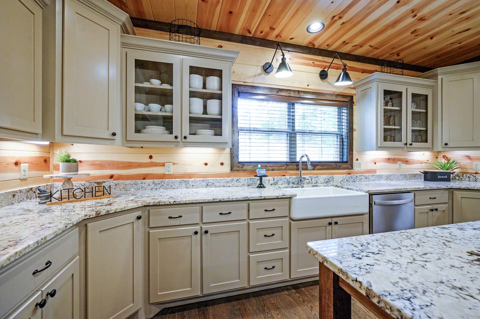 This kitchen is equipped with modern stainless appliances.