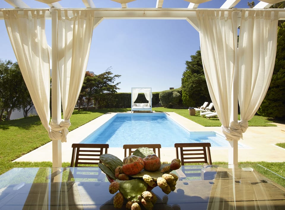 Alfresco dining by the private pool at Villa Etheria.