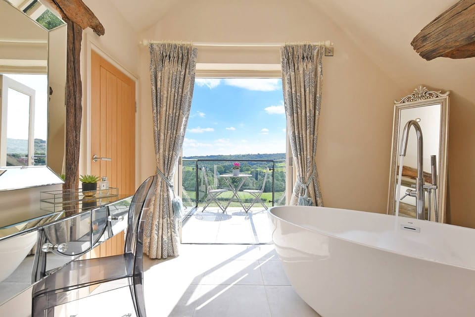 The bath tub with countryside view at Horseshoe House, Peak District