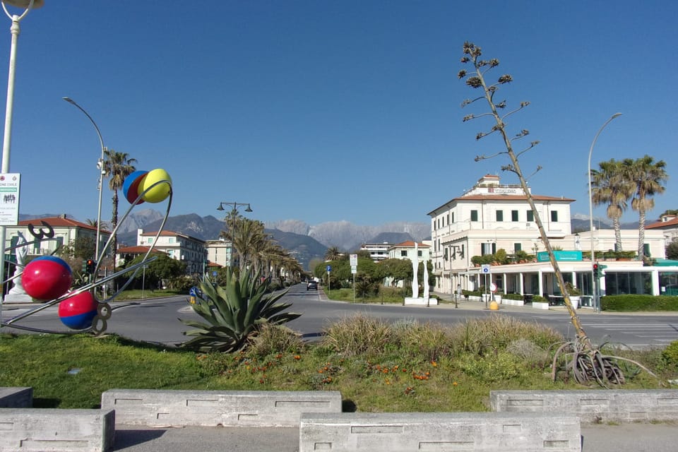 View of the alps from the main square in Marina di Massa
