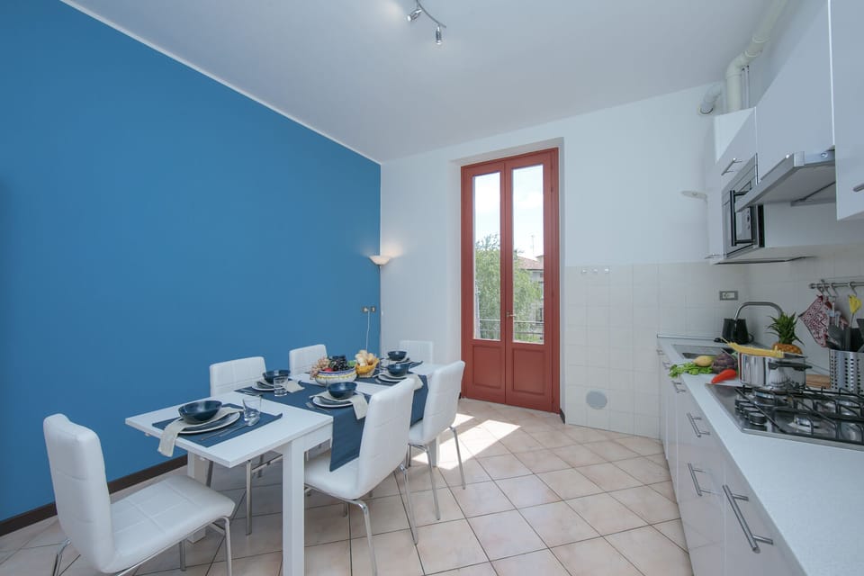 Kitchen with entrance to small balcony