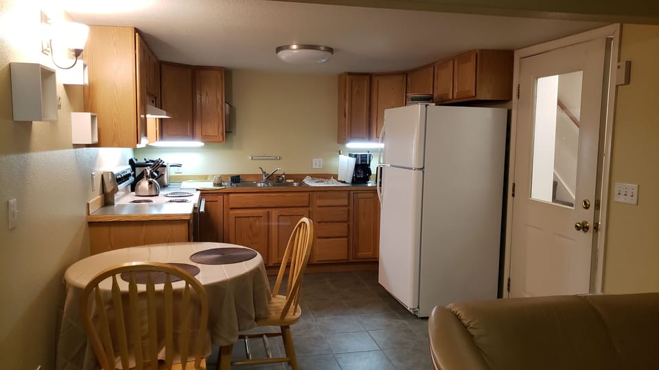 Newly remodeled kitchen with full refrigerator~freezer, stove, oven, microwave.