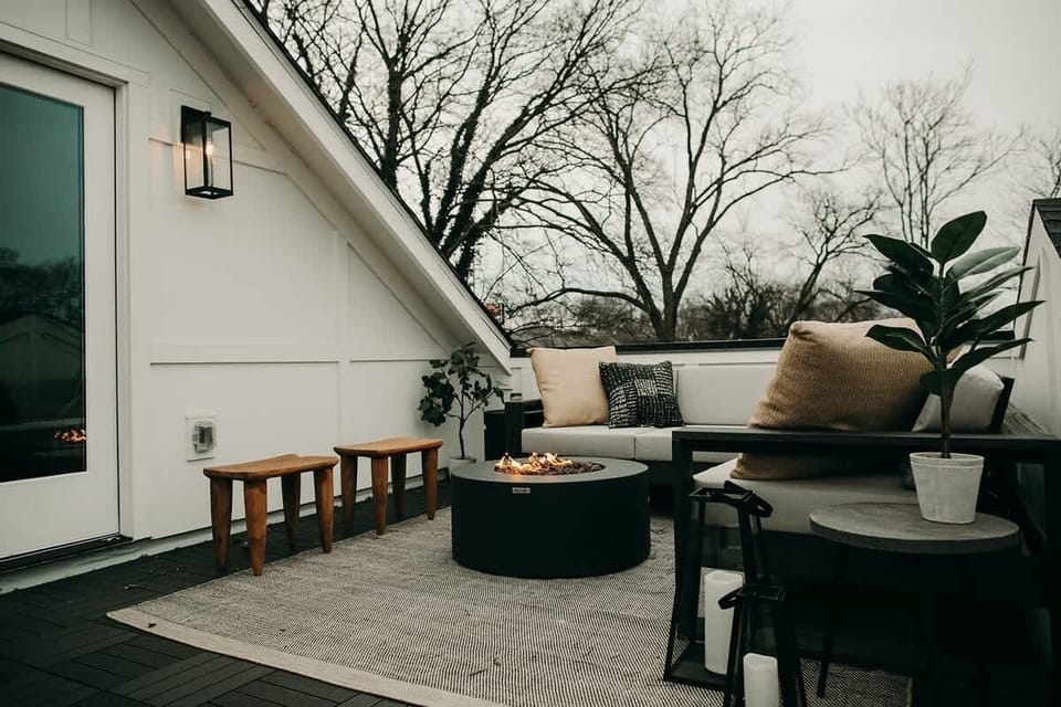 The rooftop patio features a cozy fire pit and plenty of seating.