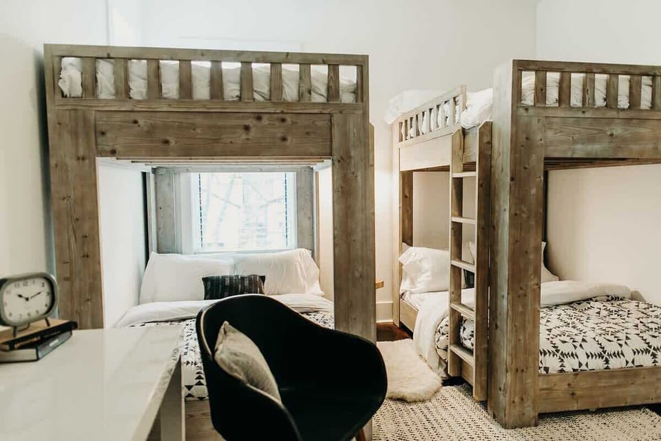 Two sets of double bunk beds (four full-sized beds) offer the perfect setup for sleepover fun.