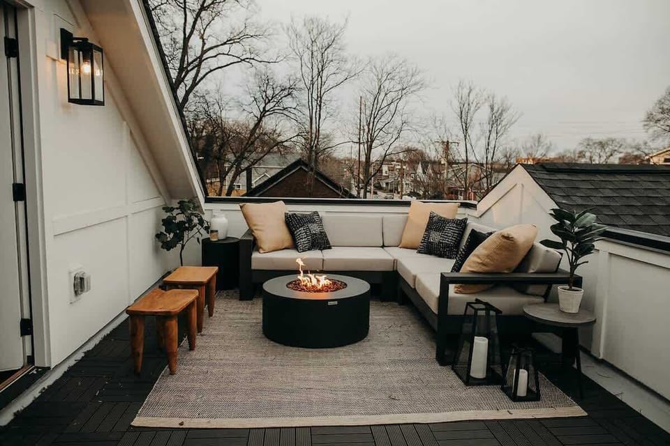 The rooftop features a large outdoor sectional with plenty of seating and a gas firepit for chilly Nashville nights.