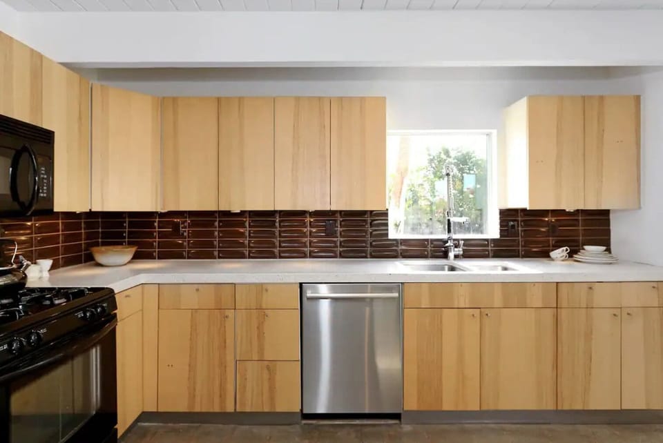 kitchen with Heath tile backsplash and terrazzo countertops