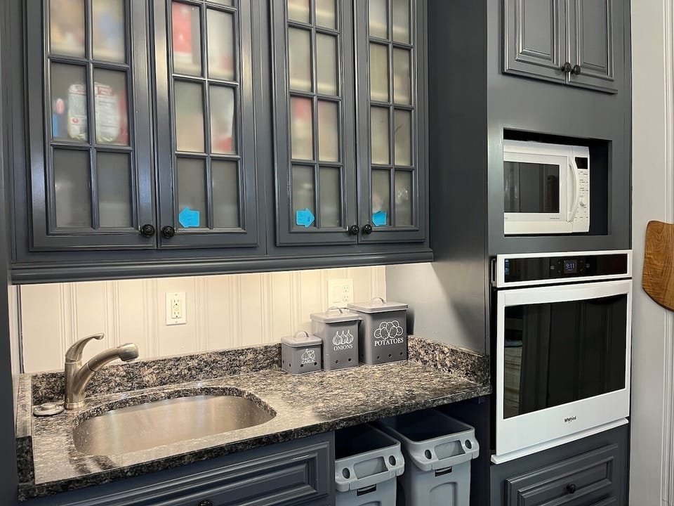 Second sink, wall oven, and combination microwave/convection oven.