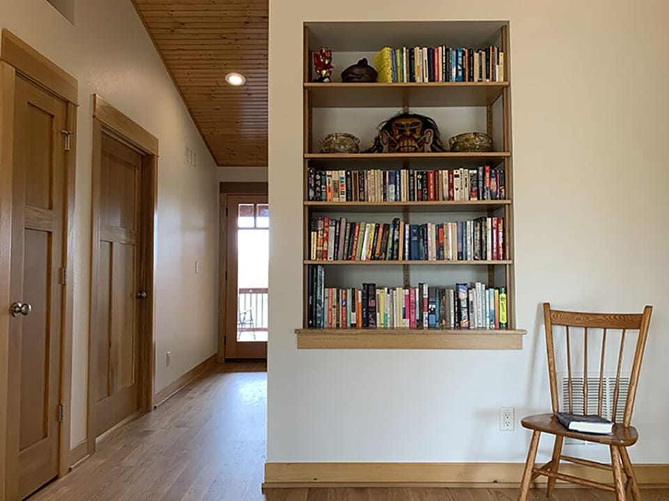Hallway to the top floor deck and bunk-beds. Grab a book on the way to the dec