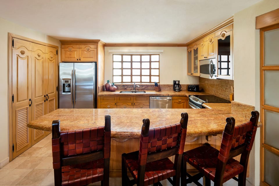 Kitchen with granite countertops and stainless appliances