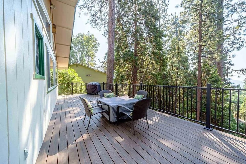 The deck set you amongst the trees and includes a table fire pit and a BBQ.