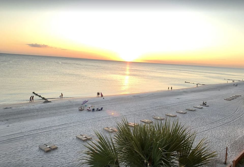 Enjoy sunset from your balcony or the beach.