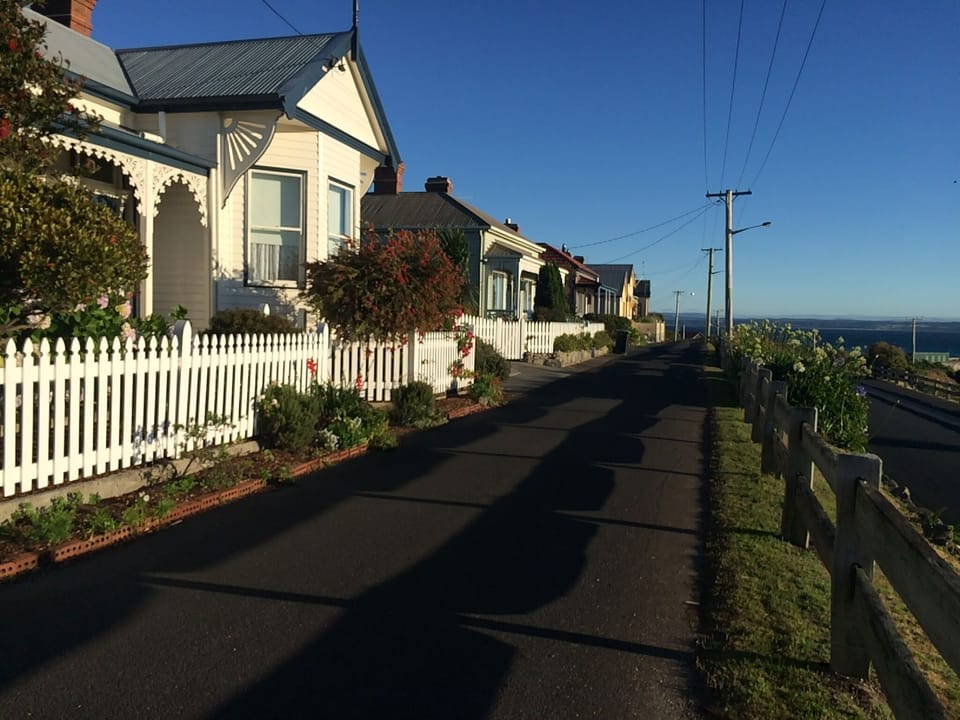 Wander along the terrace with lovely seaside cottages
