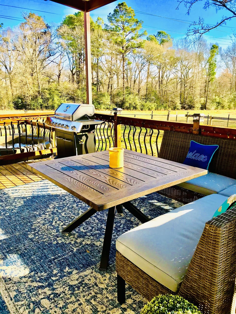 Deck with table set and grill 