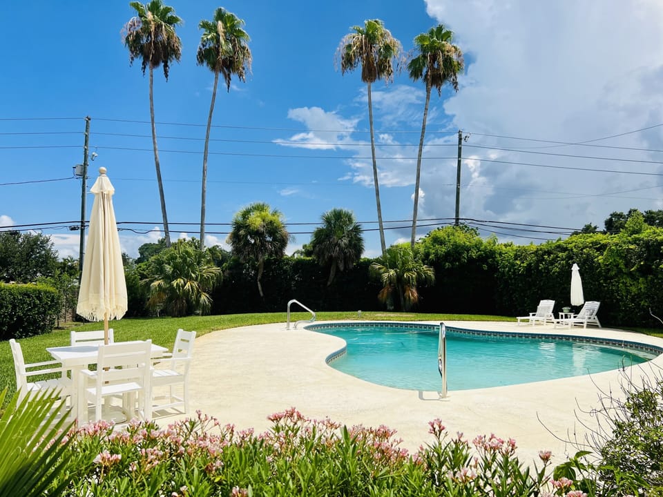 Fun private pool with grills, tables and 10 chairs, lounge chairs and fire pit. 