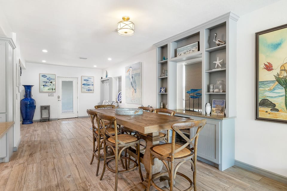 This tastefully decorated home is the perfect backdrop for your beach getaway! Dining area with seating for 6, additional bar seating for 4.