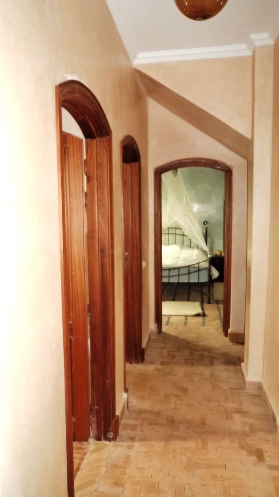 Bathroom, washing maschine and bedroom in the end of the corridor.