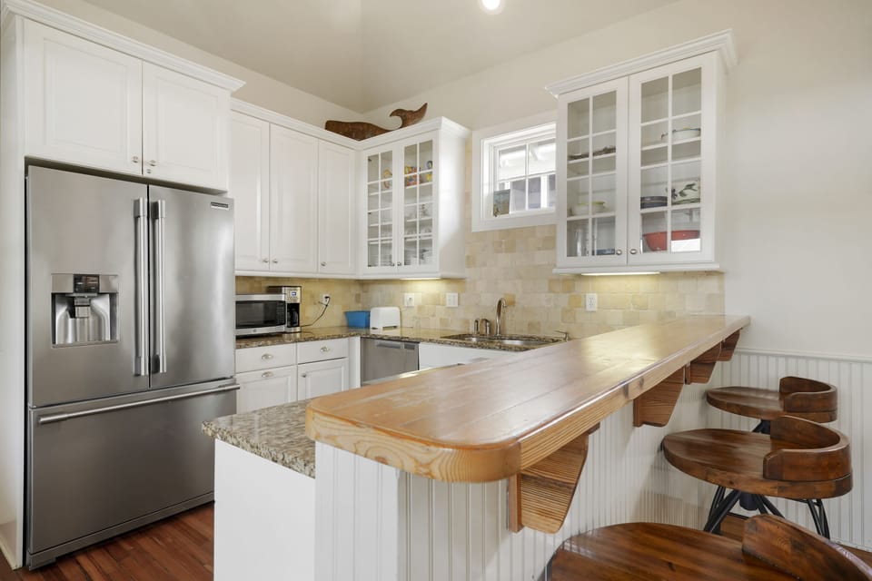KITCHEN ALTERNATE VIEW WITH BARSTOOL SEATING