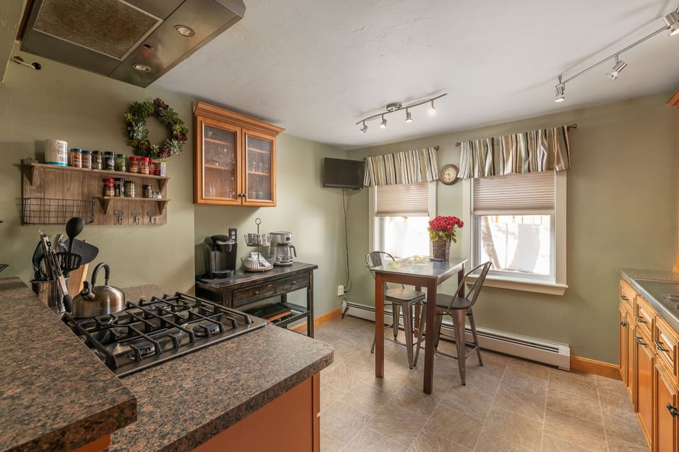 The kitchen with seating for 4 so you can socialize during meal prep