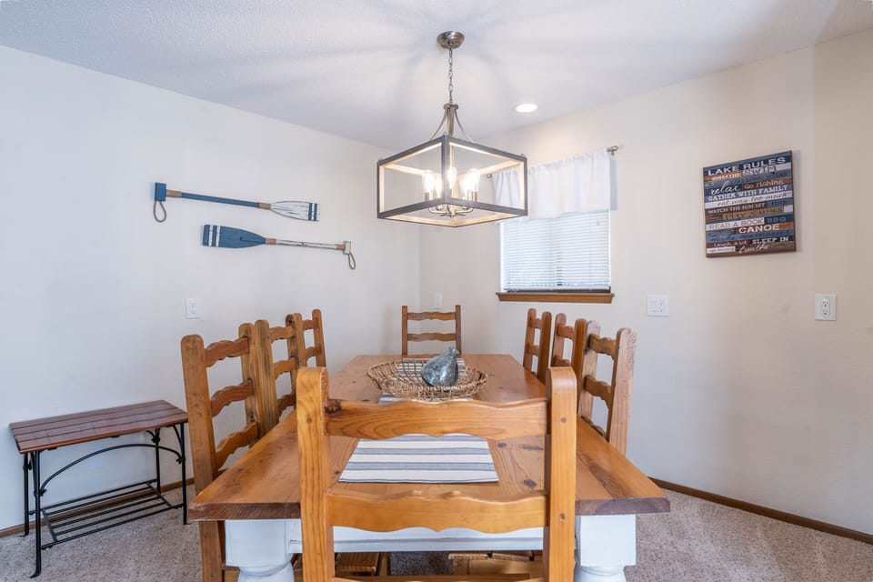 Huge dining area with seating for eight adults.