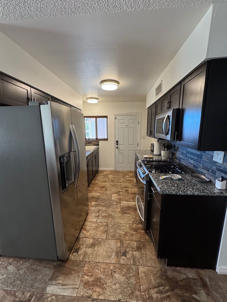 Kitchen with LG Appliances and Granite Countertops