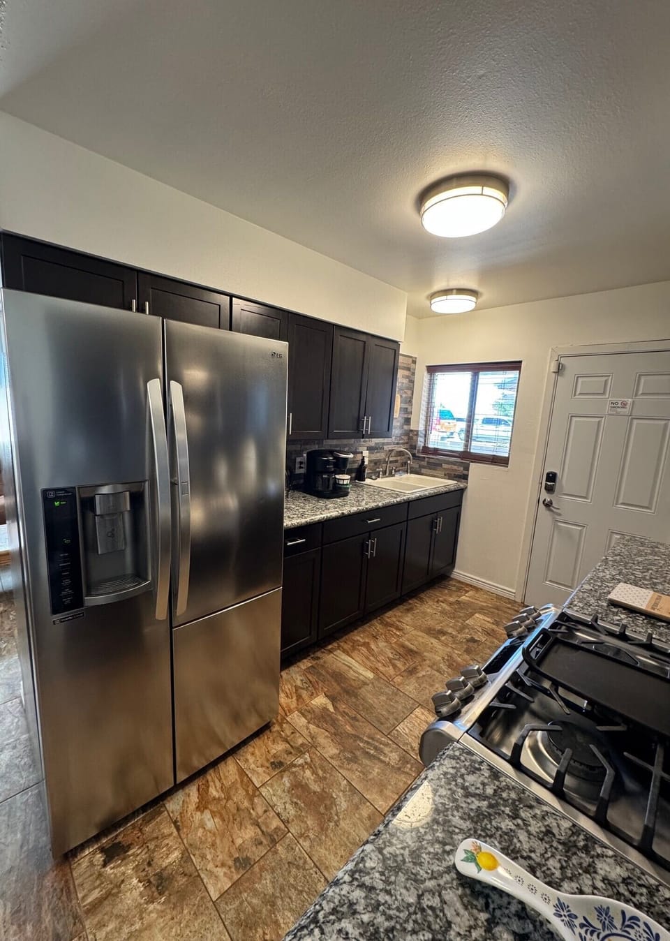 Kitchen with LG Appliances and Granite Countertops