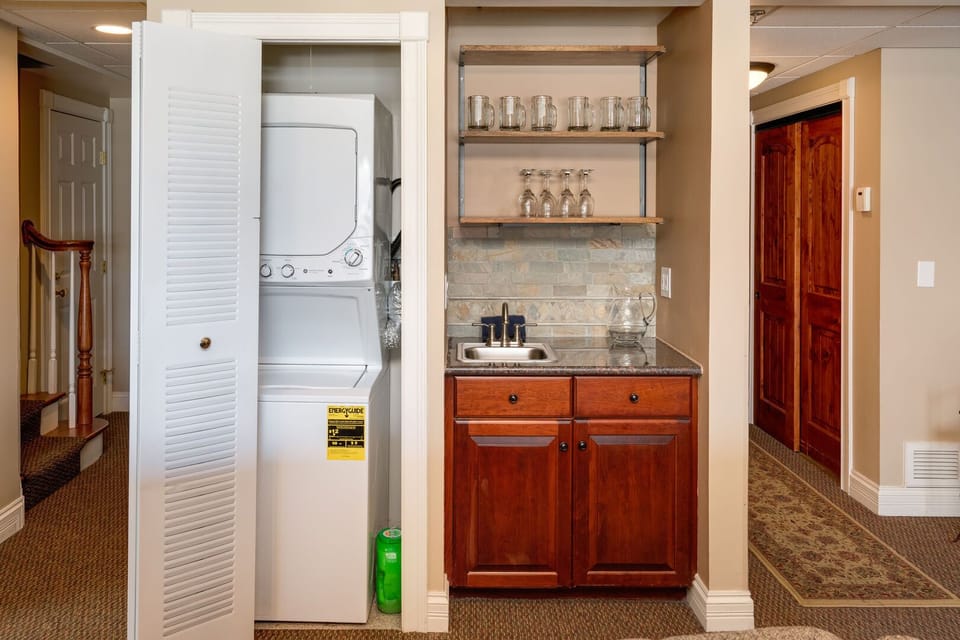 Washer and dryer behind the accordion door, Dedicated wet bar for happy hour.