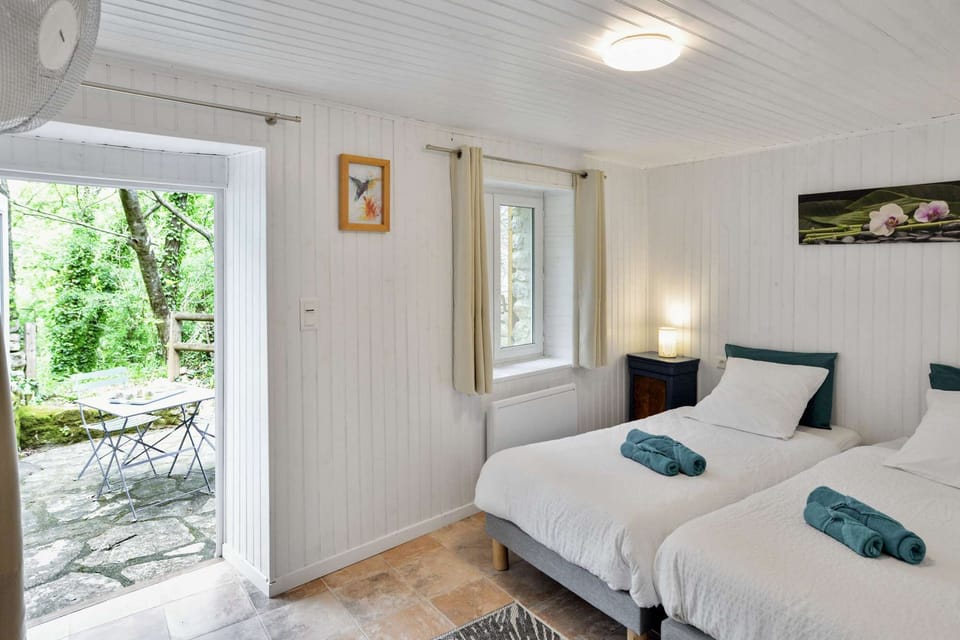 A comfortable room with a small shaded terrace