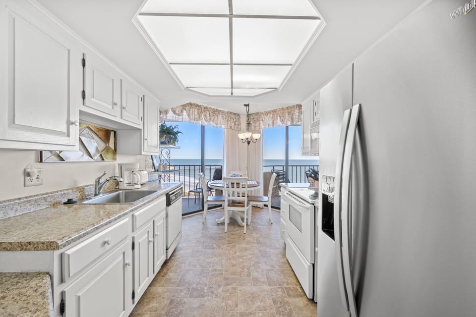 Enjoy the fully stocked kitchen with a view.