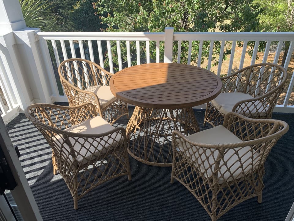 The Porch has a great view of the 9th Hole on the Greg Norman Golf course!