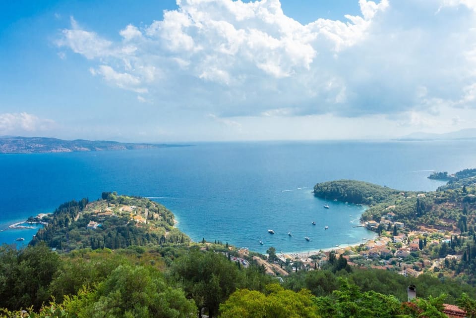 Double bedroom with en suite bathroom, A/C, and upper terrace access with panoramic sea views