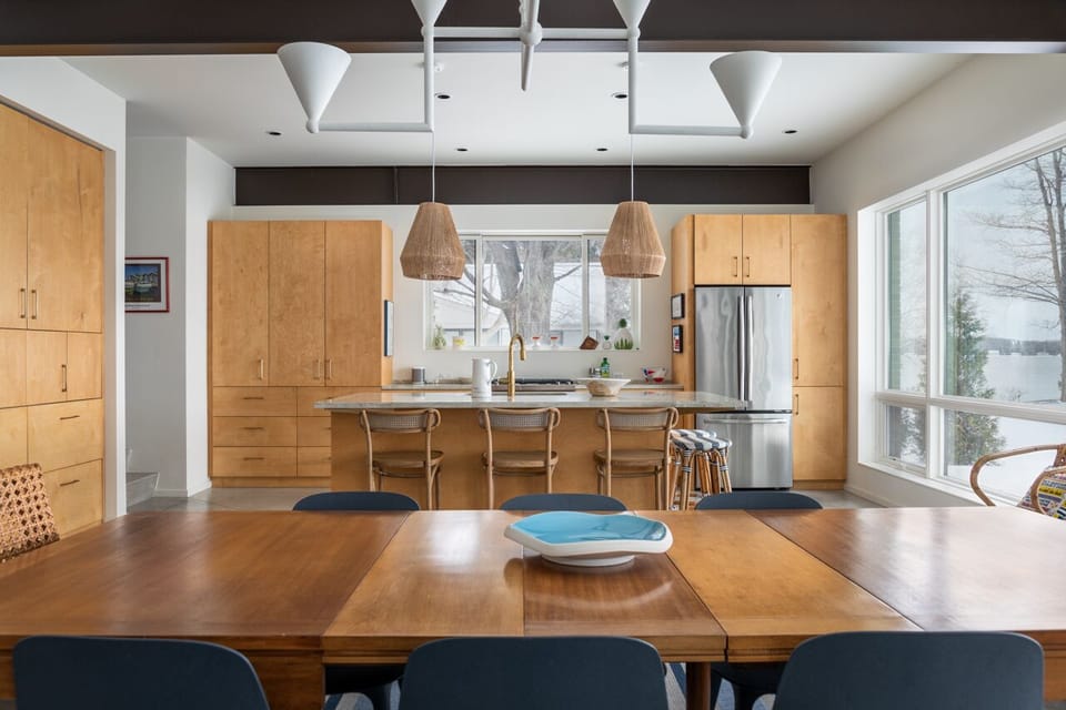 Openplan kitchen space with island for gathering.  Dining area for 8 guests