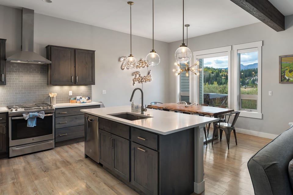 Bright open living space with large windows and natural light   - Easy access to patio and kitchen for group entertaining and dining   - Relax after skiing in this welcoming Colorado mountain retreat