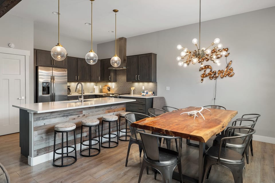 - Open dining and kitchen layout with stylish lighting and seating   - Rustic modern design creates the perfect Colorado mountain vibe   - Spacious setting for group meals and après ski celebrations
