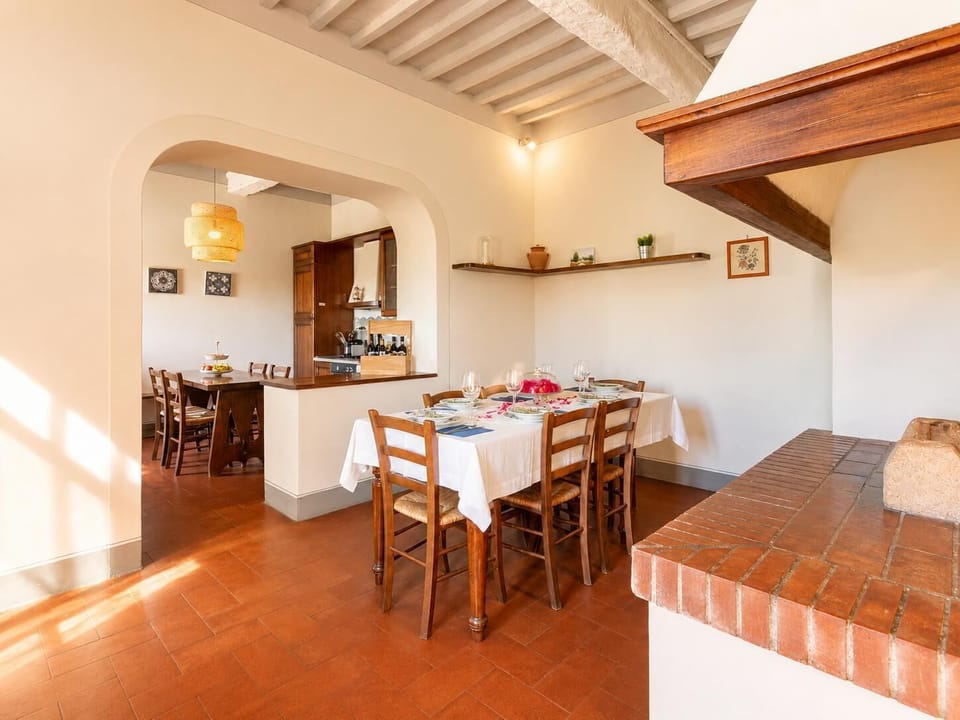 Dining room with kitchen, ornamental fireplace, WiFi internet, satellite TV, and terrace access
