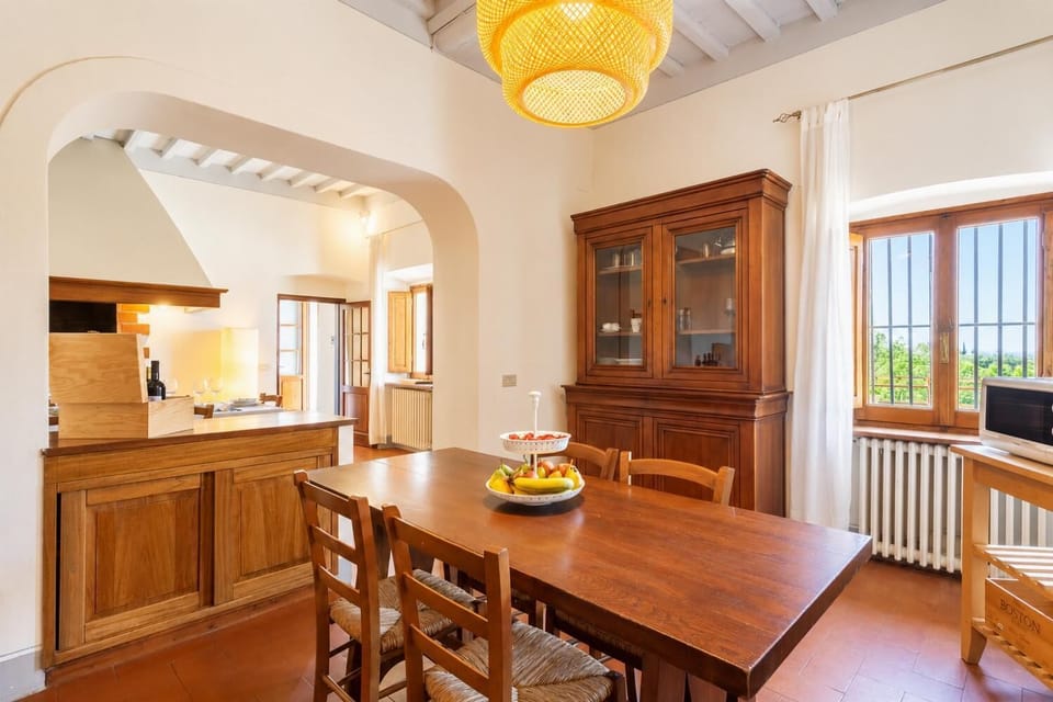 Dining room with kitchen, ornamental fireplace, WiFi internet, satellite TV, and terrace access